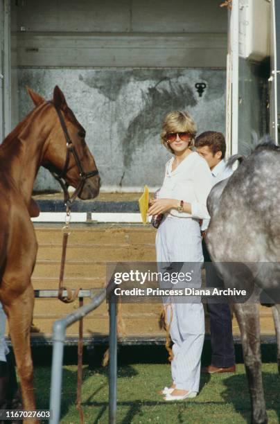 Diana, Princess of Wales attends a polo match at Cowdray Park Polo Club in West Sussex on her second wedding anniversary, 29th July 1983.