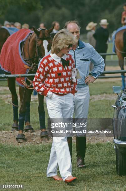 Diana, Princess of Wales with Major Ronald Ferguson at a polo match at Smith's Lawn, Guards Polo Club, Windsor, June 1983. Diana is wearing a Muir...