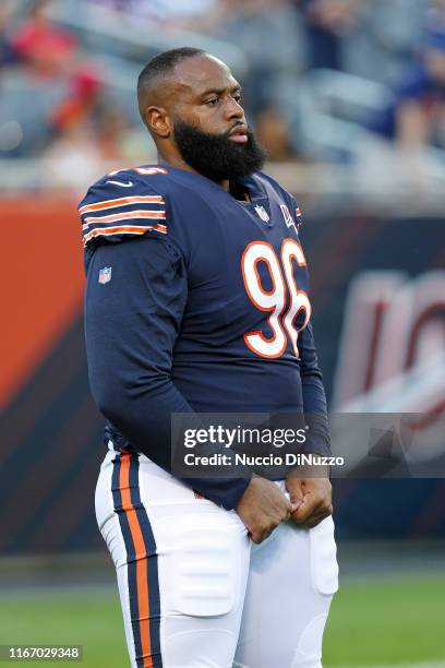 Akiem Hicks of the Chicago Bears adjusts his pants during warm up prior to a preseason game against the Carolina Panthers at Soldier Field on August...