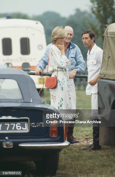 Diana, Princess of Wales and Prince Charles with Major Ronald Ferguson at a polo match on Smith's Lawn, Guards Polo Club, Windsor, 6th July 1983.