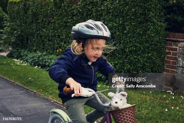 child riding a bicycle - junge fahrrad stock-fotos und bilder