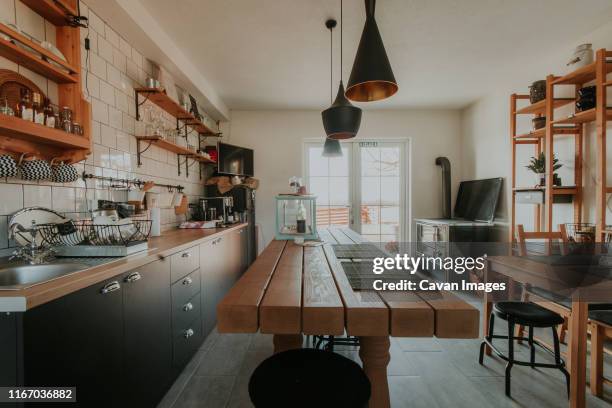 creative dining room and kitchen in a small house. - traditional home interior stock pictures, royalty-free photos & images
