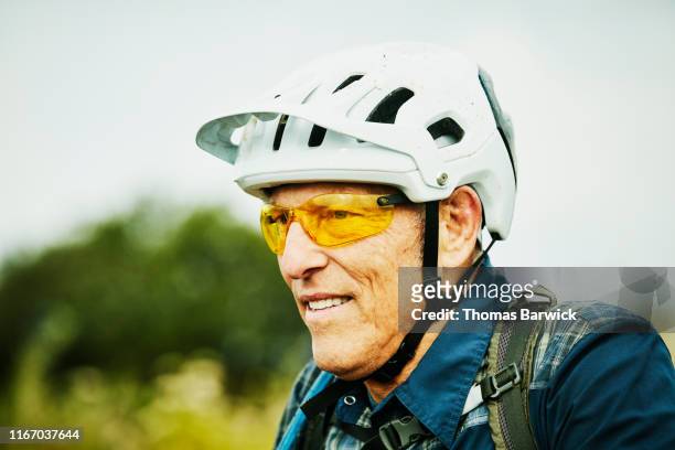 Portrait of senior man resting during mountain bike ride