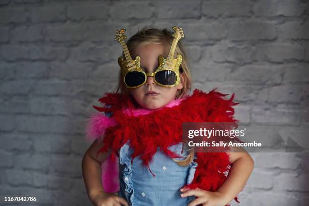 child dressing up novelty glasses - feather boa stock pictures, royalty-free photos & images