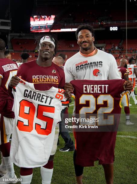 Myles Garrett of the Cleveland Browns and Deshazor Everett of the Washington Redskins trade jerseys after the game at FirstEnergy Stadium on August...