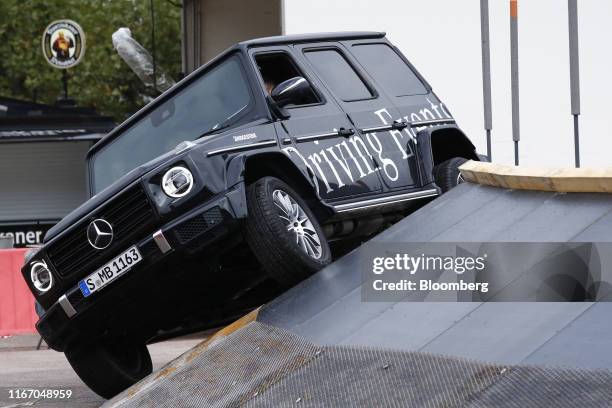 Mercedes-Benz G-Class off-roader stands outside the Daimler AG exhibition hall ahead of the IAA Frankfurt Motor Show in Frankfurt, Germany, on...