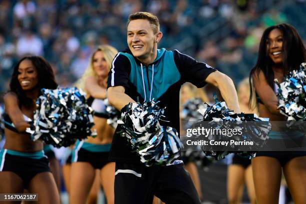 Kyle Tanguay, the first male cheerleader for the Philadelphia Eagles, performs before a preseason game against the Tennessee Titans at Lincoln...