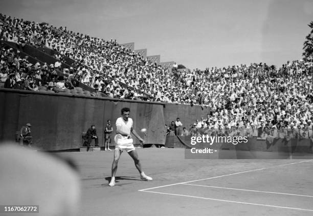 French tennis player Jean Louis Haillet prepares a forehand in his match against Sweden's Lennart Bergelin here 25 july 1954 at Roland Garros stadium...