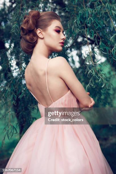 stuck in a pink fairytale - pink dress stock pictures, royalty-free photos & images