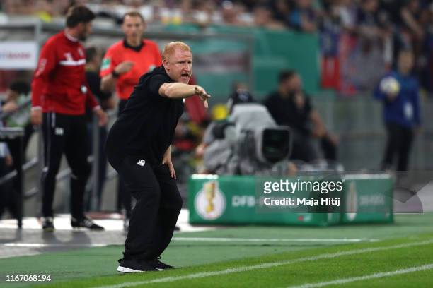 Heiko Vogel, Head Coach of KFC Uerdingen gives his team instructions during the DFB Cup first round match between KFC Uerdingen and Borussia Dortmund...