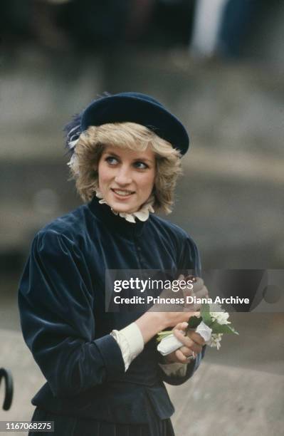 Diana, Princess of Wales during a visit to Nottingham, UK, March 1985. She is wearing a blue velvet suit by Caroline Charles and a John Boyd hat.