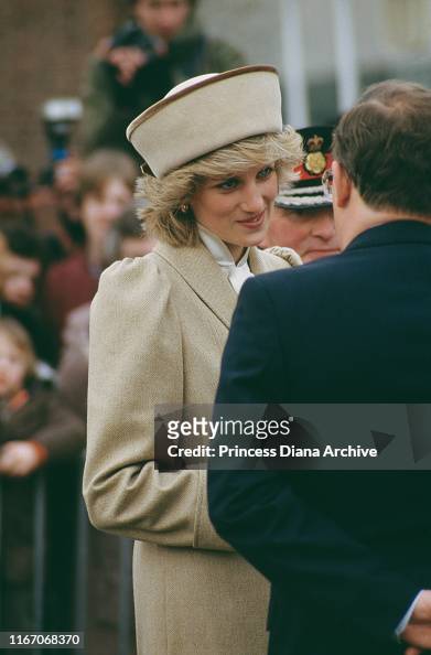 Diana, Princess of Wales wearing a beige Caroline Charles coat during ...