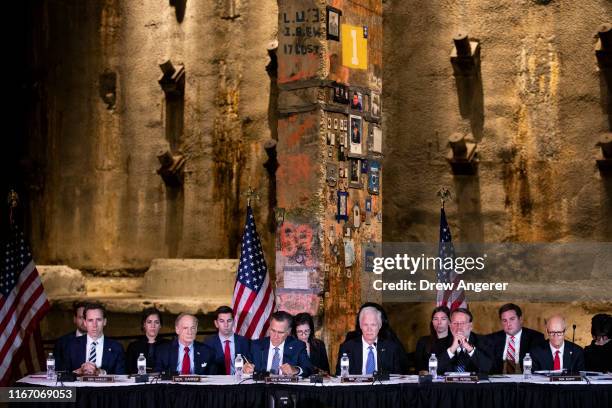 With a piece of steel and concrete from the original World Trade Center behind them, U.S. Senators Josh Hawley , Tom Carper , Mitt Romney , Ron...