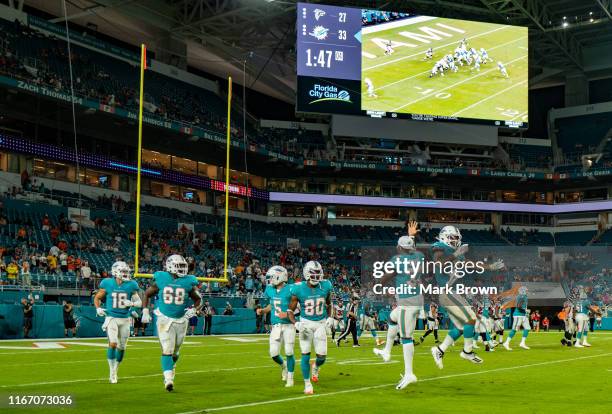 Miami Dolphins celebration a touchdown by Myles Gaskin during a preseason game against the Atlanta Falcons at Hard Rock Stadium on August 8, 2019 in...