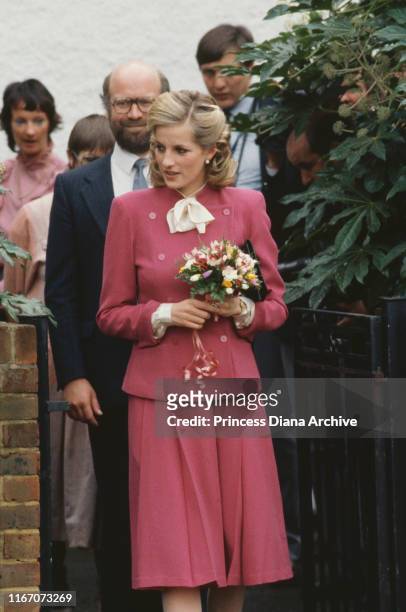 Diana, Princess of Wales wearing a pink Jasper Conran suit and a new hairstyle during a visit to Ealing, London, November 1984.