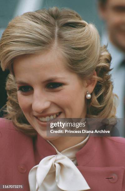 Diana, Princess of Wales wearing a pink Jasper Conran suit and a new hairstyle during a visit to Ealing, London, November 1984.