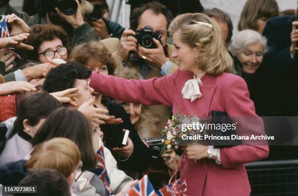 Diana, Princess of Wales wearing a pink Jasper Conran suit and a new hairstyle during a visit to Ealing, London, November 1984.