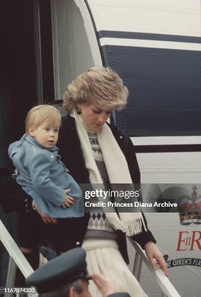 Diana, Princess of Wales and Prince Harry arrive at Aberdeen airport in Scotland on The Queen's Flight, March 1986.