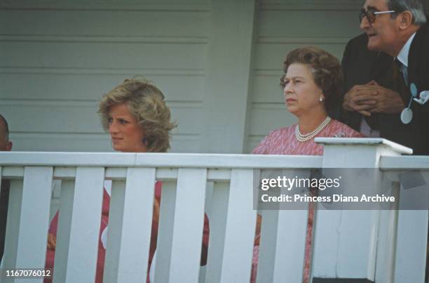 Diana, Princess of Wales with Queen Elizabeth II during a polo match at Smith's Lawn, Guards Polo Club, Windsor, July 1984. Diana is pregnant with...