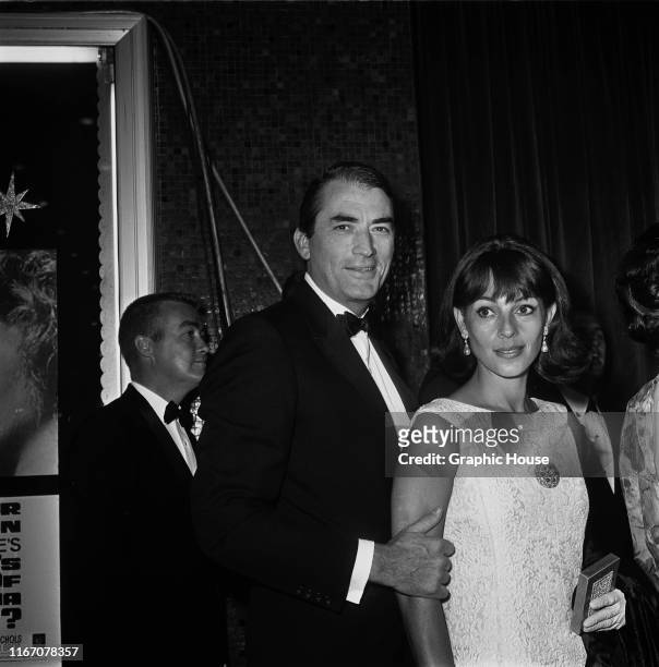 American actor Gregory Peck and his wife Veronique at the premiere of the film 'Who's Afraid of Virginia Woolf?' in Hollywood, California, 21st June...
