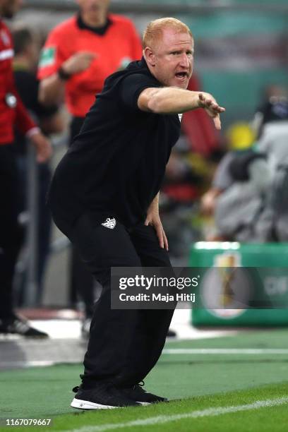 Heiko Vogel, Head Coach of KFC Uerdingen gives his team instructions during the DFB Cup first round match between KFC Uerdingen and Borussia Dortmund...