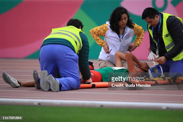 Jesus Lopez of Mexico receives medical attention after Men's 800m Semifinal on Day 14 of Lima 2019 Pan American Games at Athletics Stadium of Villa...