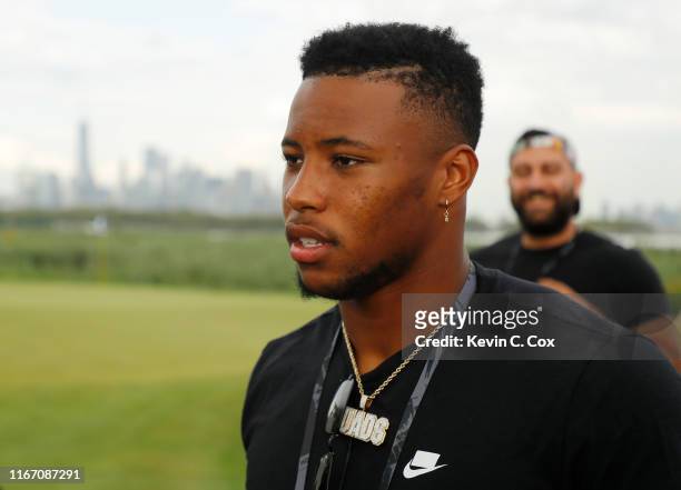 Saquon Barkley of the New York Giants looks on during the second round of The Northern Trust at Liberty National Golf Club on August 09, 2019 in...