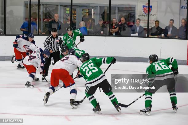 Trey Fix-Wolansky of the Columbus Blue Jackets faces off against Rhett Gardner of the Dallas Stars during Day-4 of the NHL Prospects Tournament at...