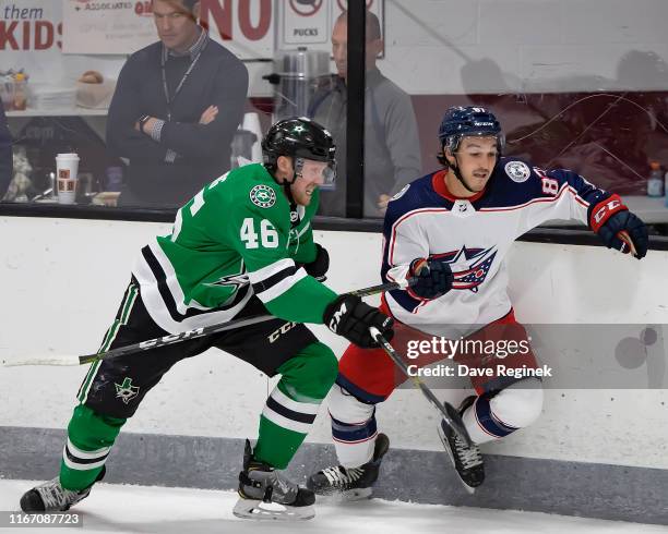 John Nyberg of the Dallas Stars battles along the boards with Kyle Maksimovich of the Columbus Blue Jackets during Day-4 of the NHL Prospects...