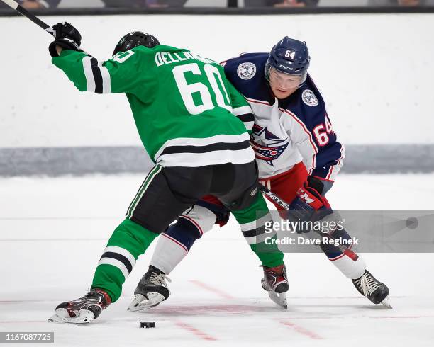 Trey Fix-Wolansky of the Columbus Blue Jackets faces off against Ty Dellandrea of the Dallas Stars during Day-4 of the NHL Prospects Tournament at...