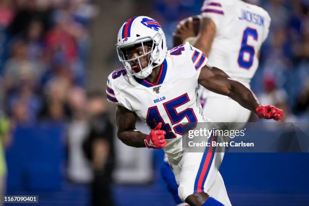 Christian Wade of the Buffalo Bills runs in the back field during the fourth quarter of a preseason game against the Indianapolis Colts at New Era...