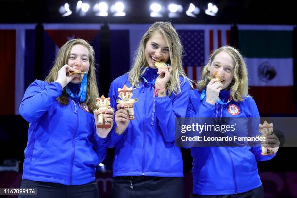 Gold medalists Chloe Fox Gitomer, Monica Aksamit and Anne Elizabeth Stone of United States celebrate in the podium of Fencing Women's Sabre Team Gold...