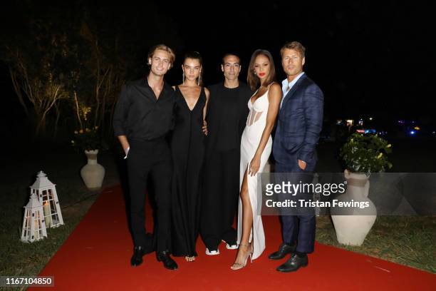 Neels Visser, Meghan Roche, Mohammed Al Turki, Joan Smalls and Glen Powell attend the cocktail at the Unicef Summer Gala Presented by Luisaviaroma at...