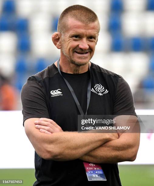 Graham Rowntree, a former English rugby player and current forwards coach of the Georgian National Rugby Team conducts a warm up before the...