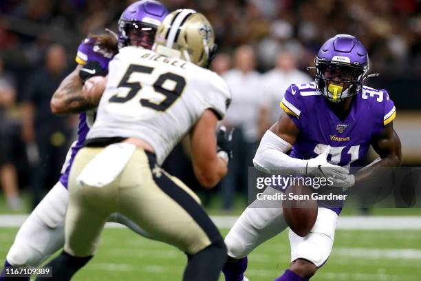 Ameer Abdullah of the Minnesota Vikings fumbles the ball during the first half of a preseason game against the New Orleans Saints at Mercedes Benz...