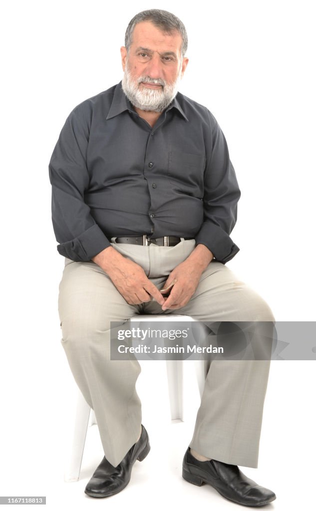 Elder man sitting on chair