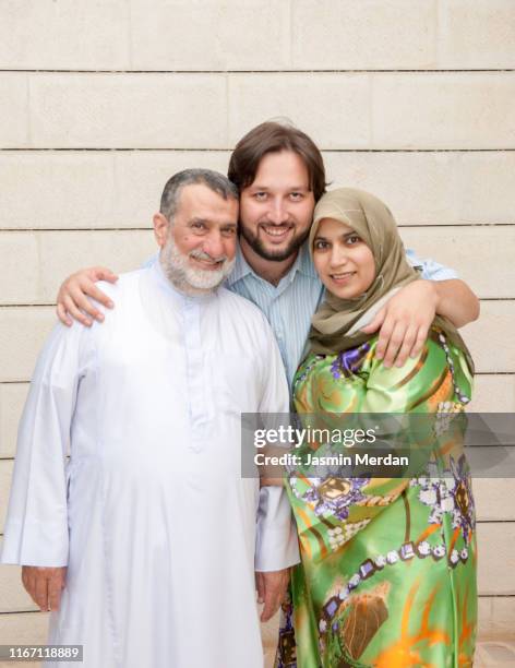 muslim family portrait - old saudi man stock pictures, royalty-free photos & images