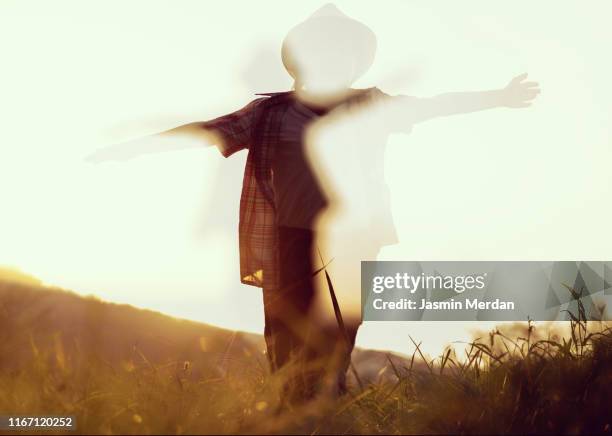 abstract kid sunset silhouette multiple exposure - blurred running sunset stock-fotos und bilder