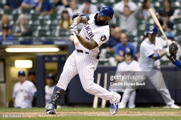 Eric Thames of the Milwaukee Brewers hits a home run in the ninth inning to beat the Texas Rangers 6-5 at Miller Park on August 09, 2019 in...