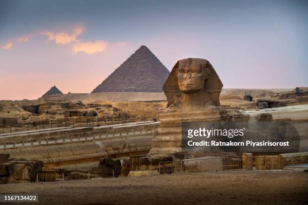 sunset scene of pyramids egypt with great sphinx - cairo nile stock pictures, royalty-free photos & images