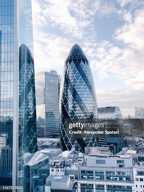 the city of london skyline with the gherkin skyscraper - sir norman foster building fotografías e imágenes de stock