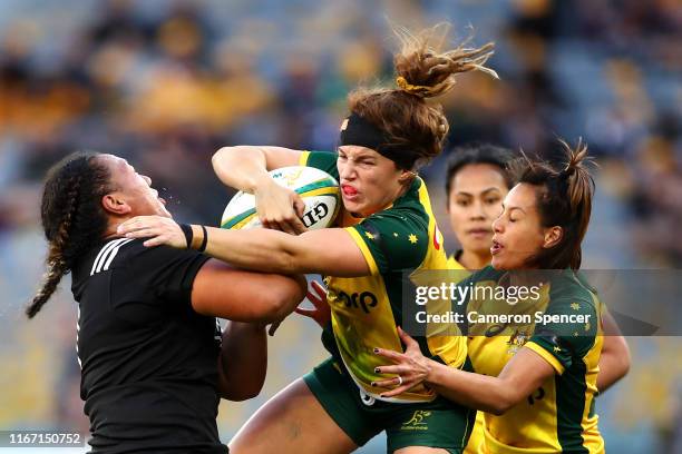 Lori Cramer of the Wallaroos is tackled during the Women's Test Match between the Australian Wallaroos and the New Zealand Black Ferns at Optus...