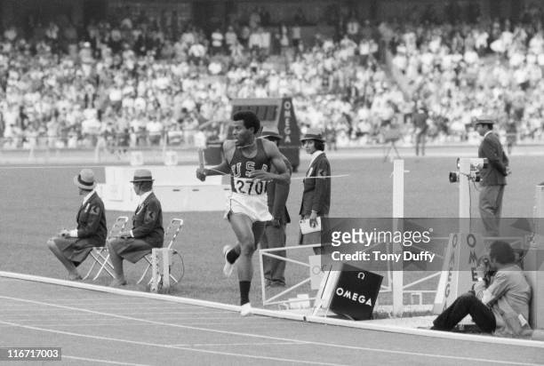 Lee Evans of the United States crosses the line to win the Men's 4 × 400 metres Relay event at the XIX Summer Olympics on 30th October 1968 at the...