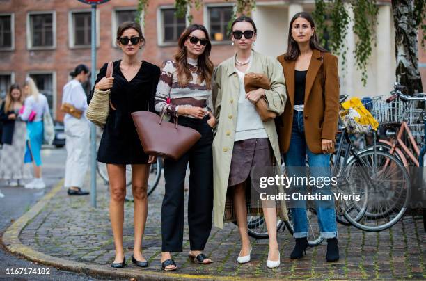 Sylvia Haghjoo wearing black velvet dress, Funda Christophersen wearing navy pants, brown white striped longshirt, Beatrice Gutu is seen wearing...