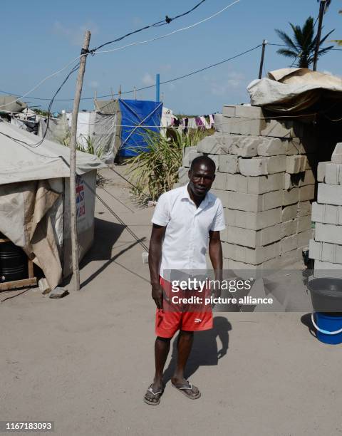 September 2019, Mozambique, Beira: Joao Deluis, the leader of a tent camp near the city of Beira, stands in front of his tent. The 31-year-old and...