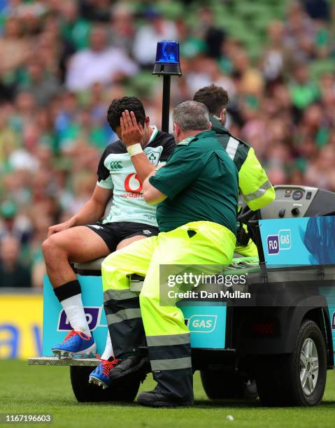 Joey Carbery of Ireland reacts as he is taken off the field injured during the Guinness Summer Series match between Ireland and Italy at the Aviva...