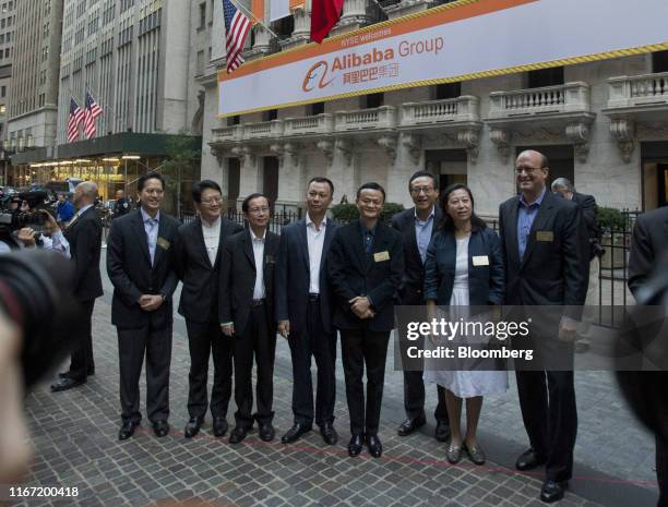 Jack Ma, billionaire and chairman of Alibaba Group Holding Ltd., fourth right, stand for a photograph with Peng Jiang, deputy chief technology...