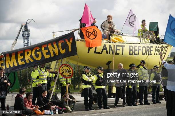 Fracking activists block the entrance to the Cuadrilla’s fracking site on September 10, 2019 near Blackpool, England. Extinction Rebellion occupied...