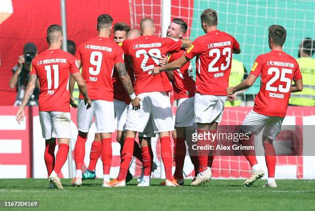 Manfred Starke of Kaiserslautern celebrates his team's first goal with team mates during the DFB Cup first round match between 1. FC Kaiserslautern...