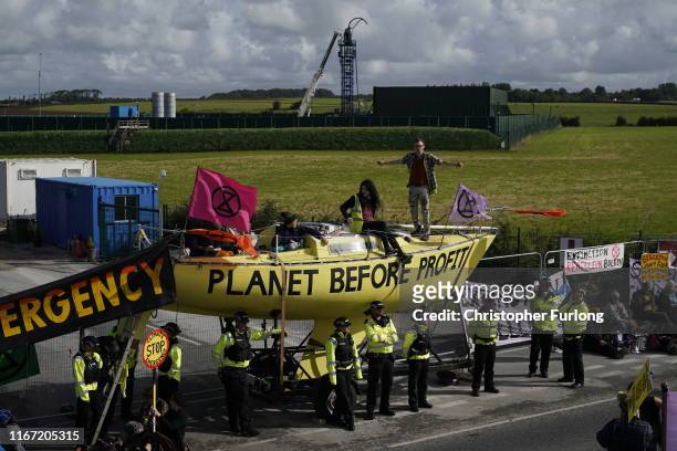 Fracking activists block the entrance to the Cuadrilla’s fracking site on September 10, 2019 near Blackpool, England. Extinction Rebellion occupied...